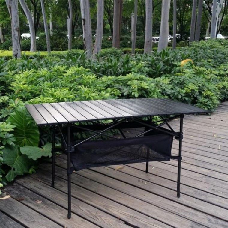 XLTSC black aluminium roll-top camping table with a mesh storage shelf on a wooden deck